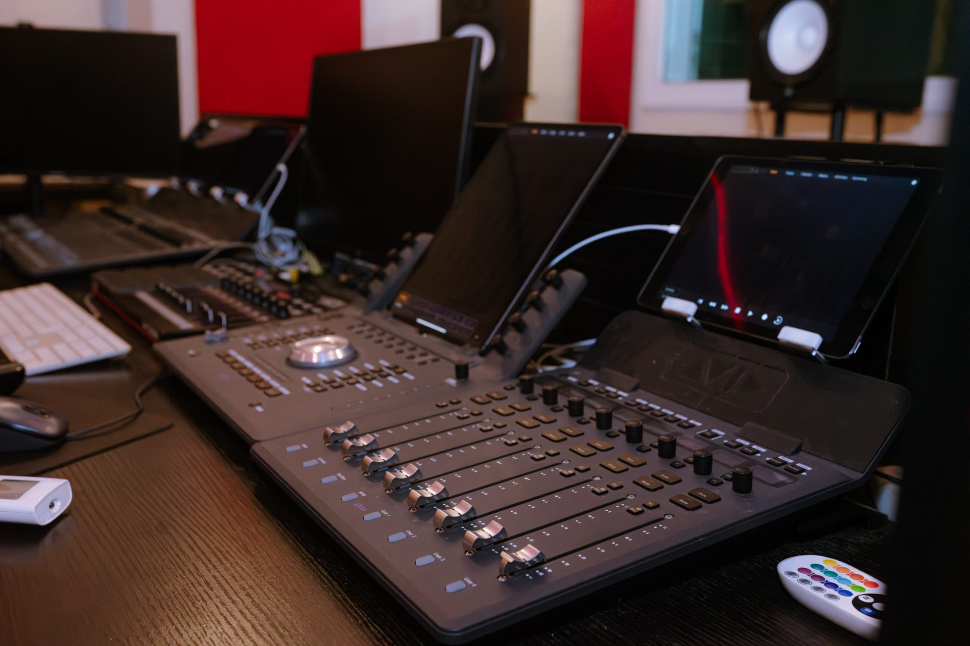 Foley recording and mixing room with control surface and tablets